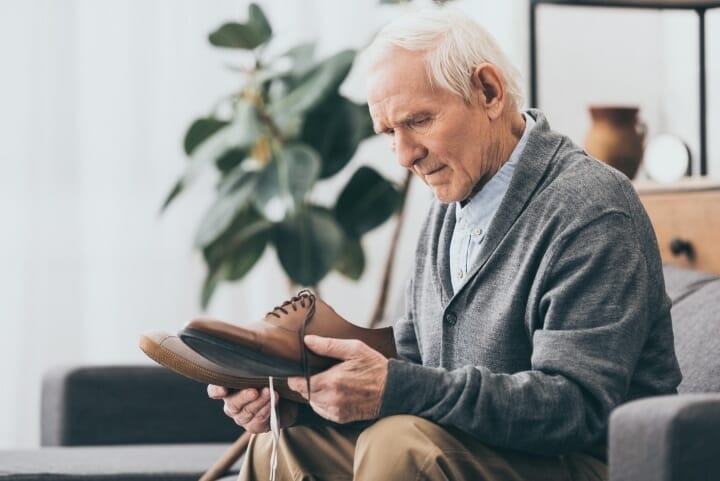 Elderly man choosing the right shoe