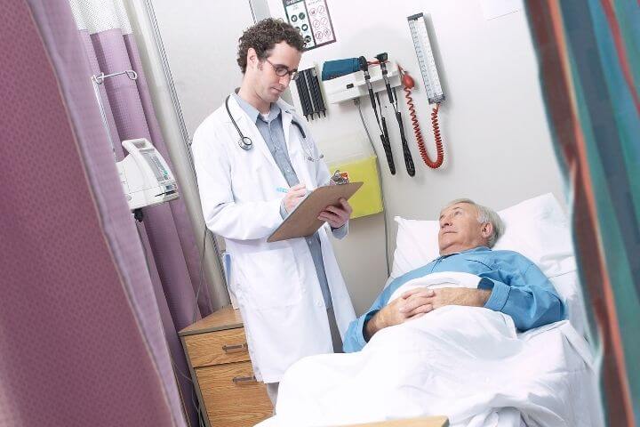 old man consulting a doctor