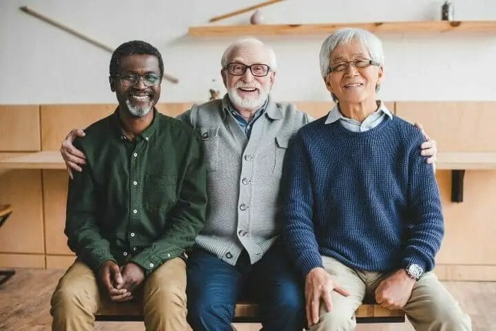 Three senior man sitting on a bench