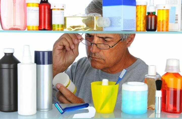 Man in front of Medicine Cabinet