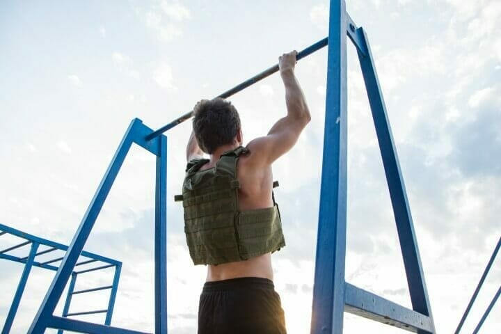 Man training outdoor with weighted vest