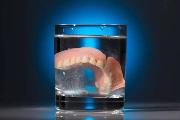 denture soak in glass of water