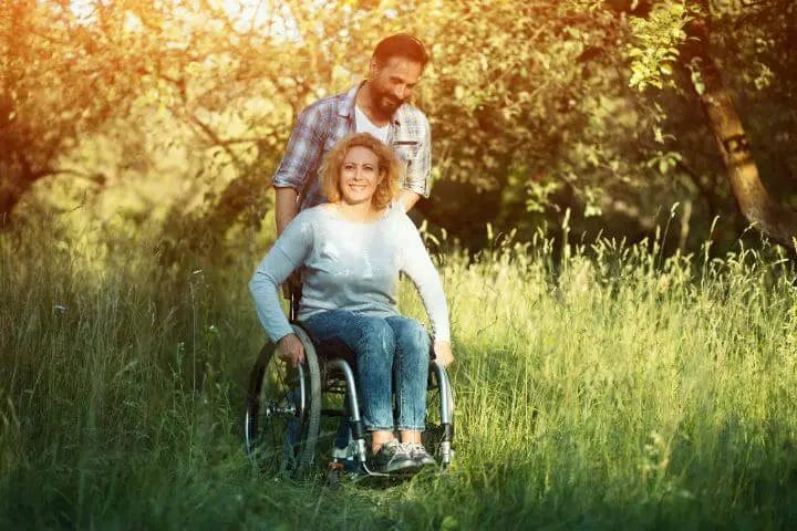 husband taking care of her paraplegic partner