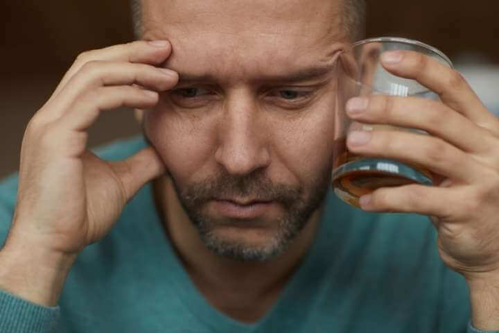man drinking alcohol