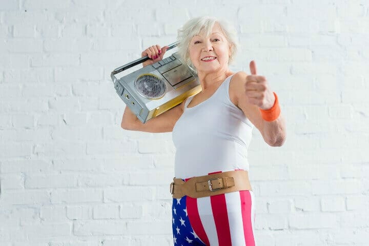 motivated old lady holding a tape recorder