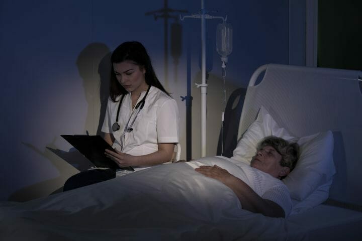 nurse with bedridden elderly